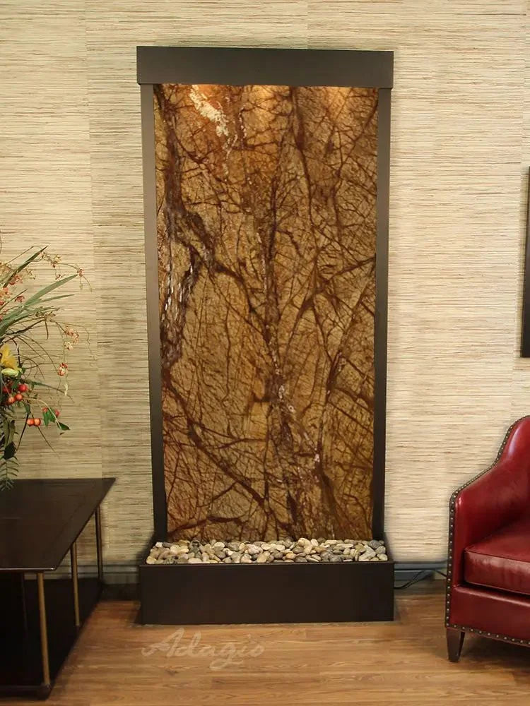 Decorative water feature with marble-like design in a room setting.