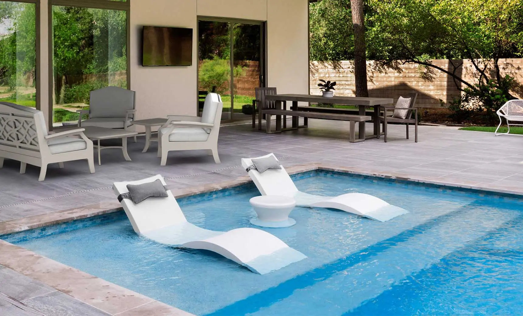 Signature chaise headrest pillow paired with a side table for in-pool use.