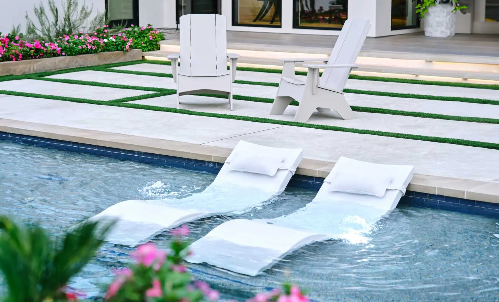 Signature pool chaise lounge with matching headrest pillow in vibrant blue fabric