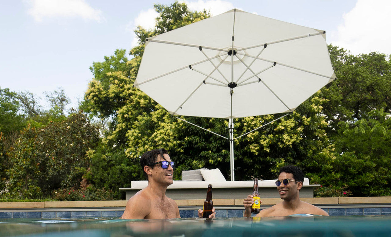 11' octagon-shaped Ultra Cantilever umbrella in black with silver poles and base