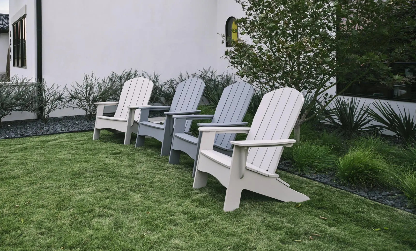 Legacy Adirondack wooden rocking chair with curved back and armrests