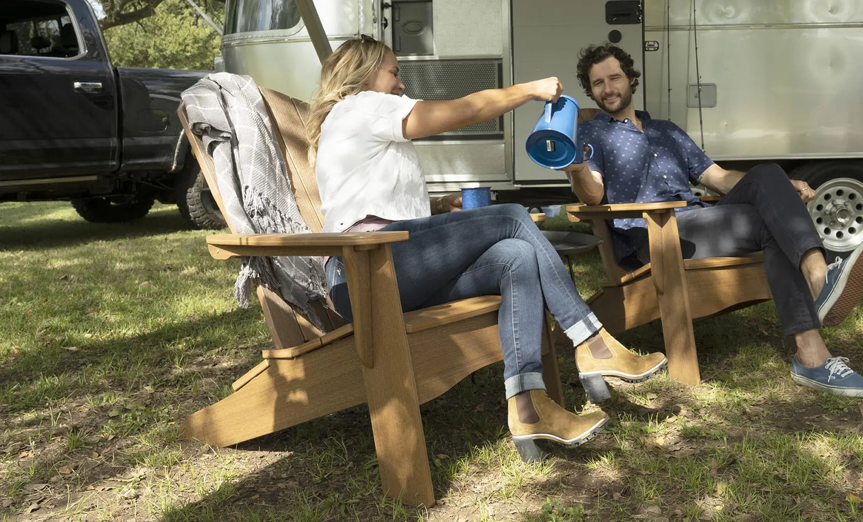 Legacy Adirondack wooden rocking chair with curved back and armrests