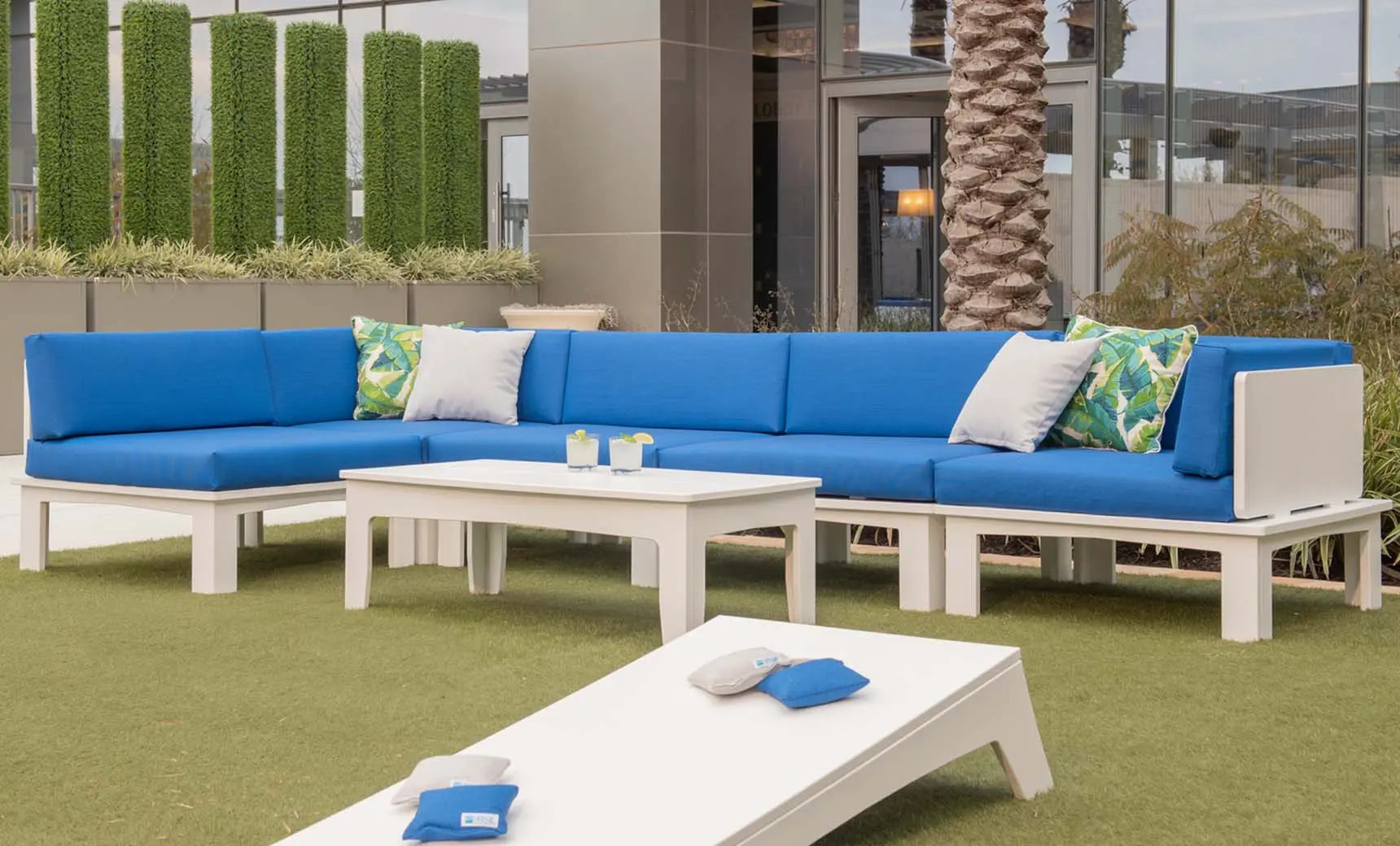 Mainstay sectional middle sofa in beige with wooden legs and button-tufted backrest.
