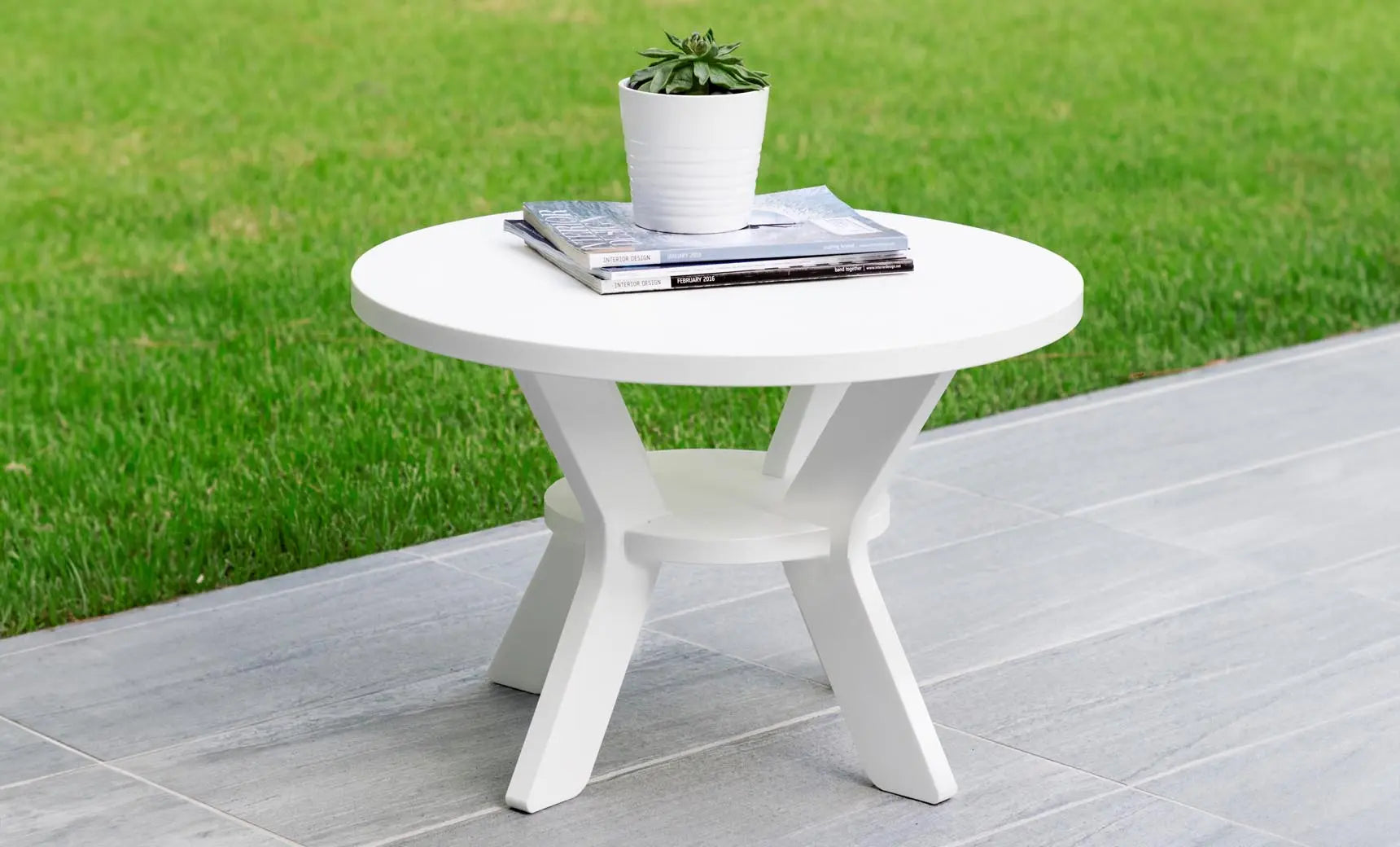 Mainstay round side table with a smooth surface and sleek design.