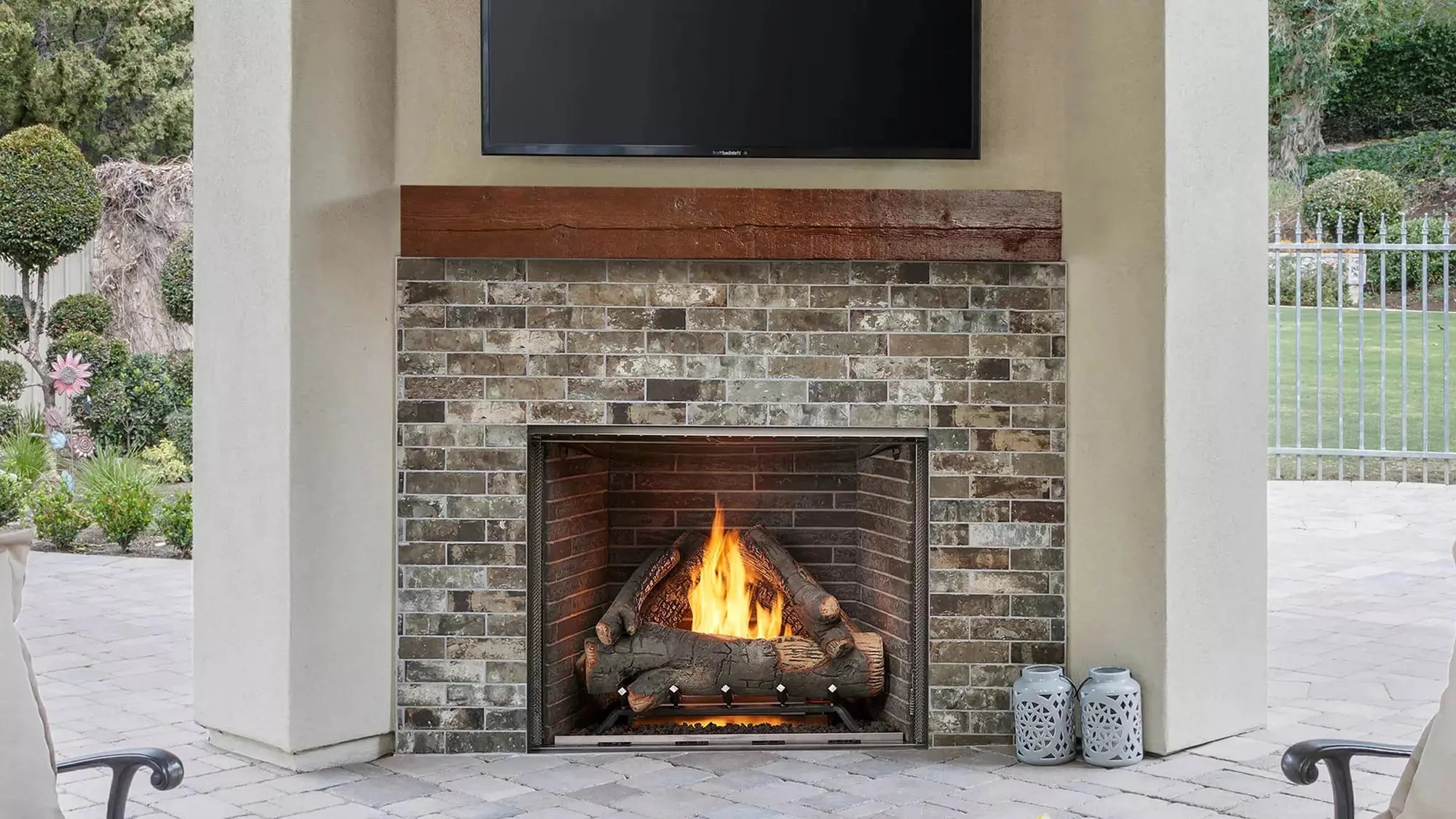 Majestic Courtyard 42" outdoor gas fireplace with modern design and glass front panel.