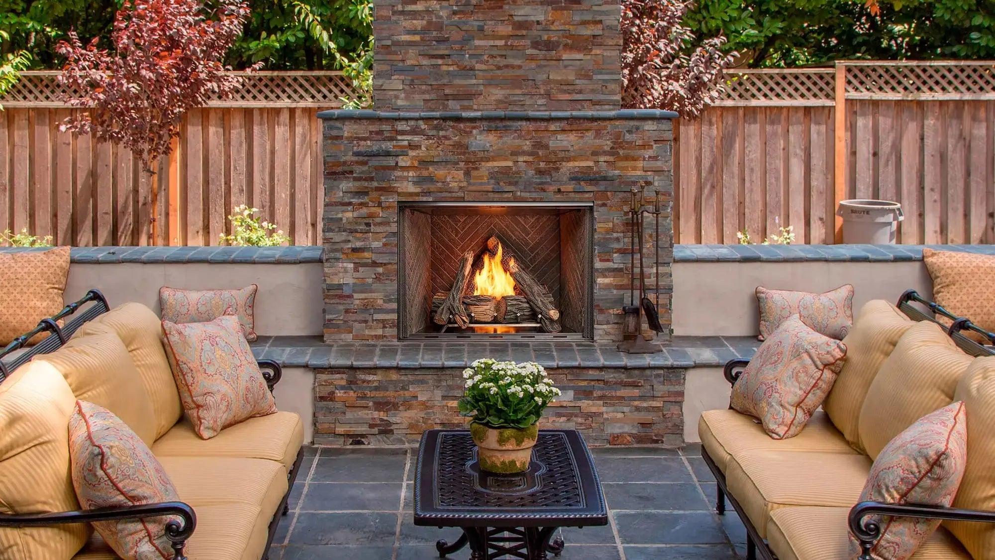 Majestic Courtyard 36-inch outdoor gas fireplace with modern design and glass front.