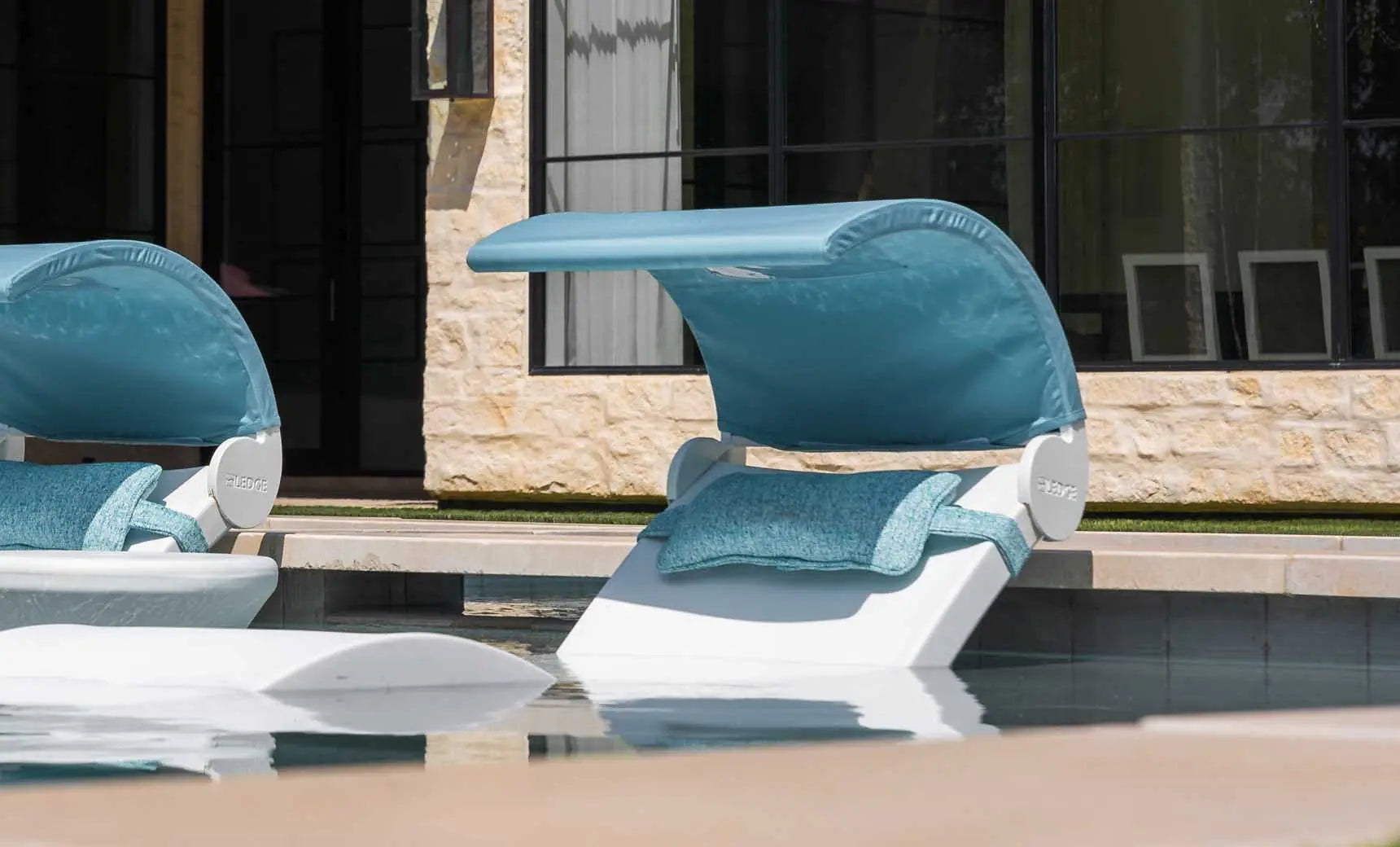 Signature chaise lounge with a brown fabric cushion and wooden frame.