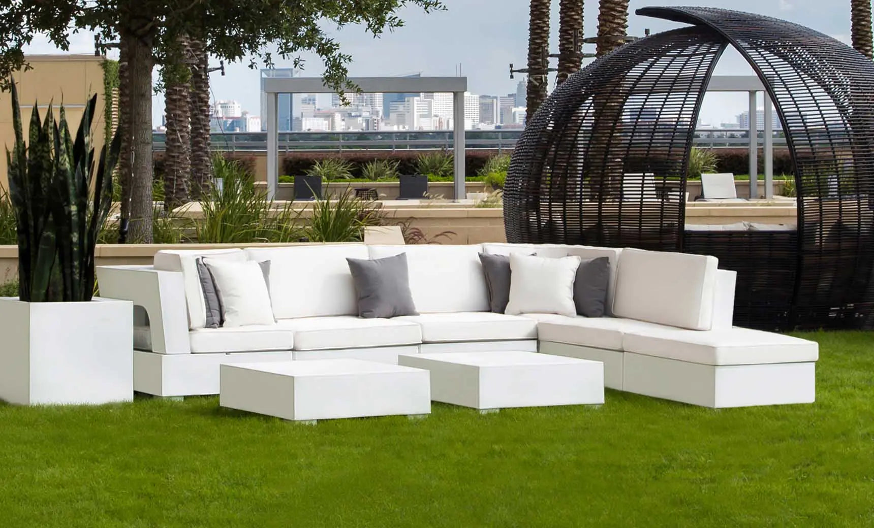 Signature coffee table with glass top and wooden legs in a modern design.