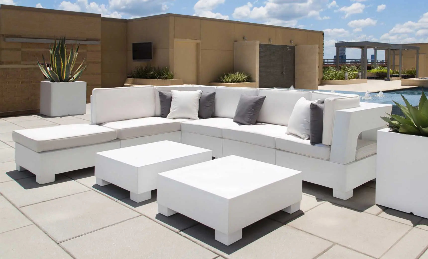 Signature coffee table with glass top and sleek wooden legs in a modern design.