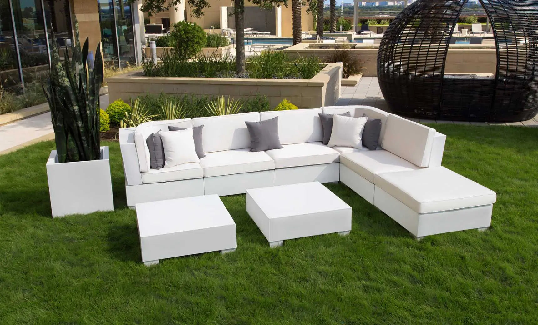 Signature coffee table with glass top and wooden legs in a modern design.