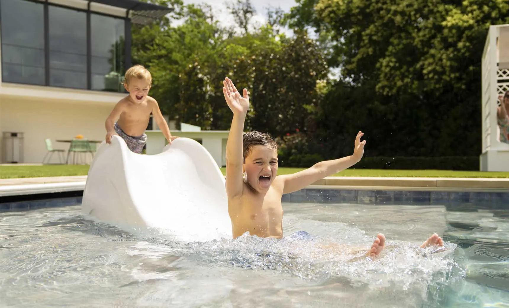 Signature Slide water slide with blue tubing and red supports