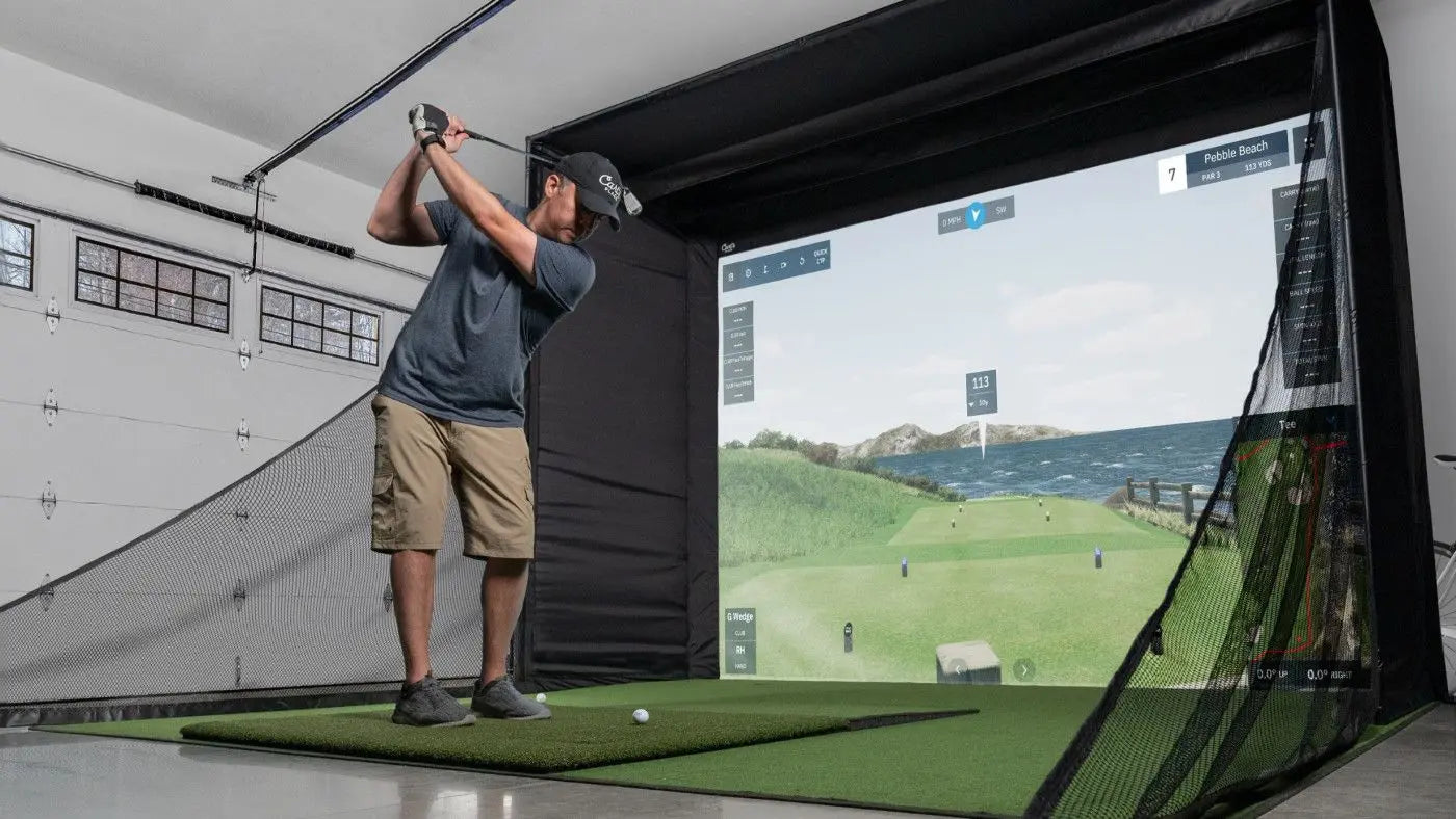Person using a golf simulator in a home setting