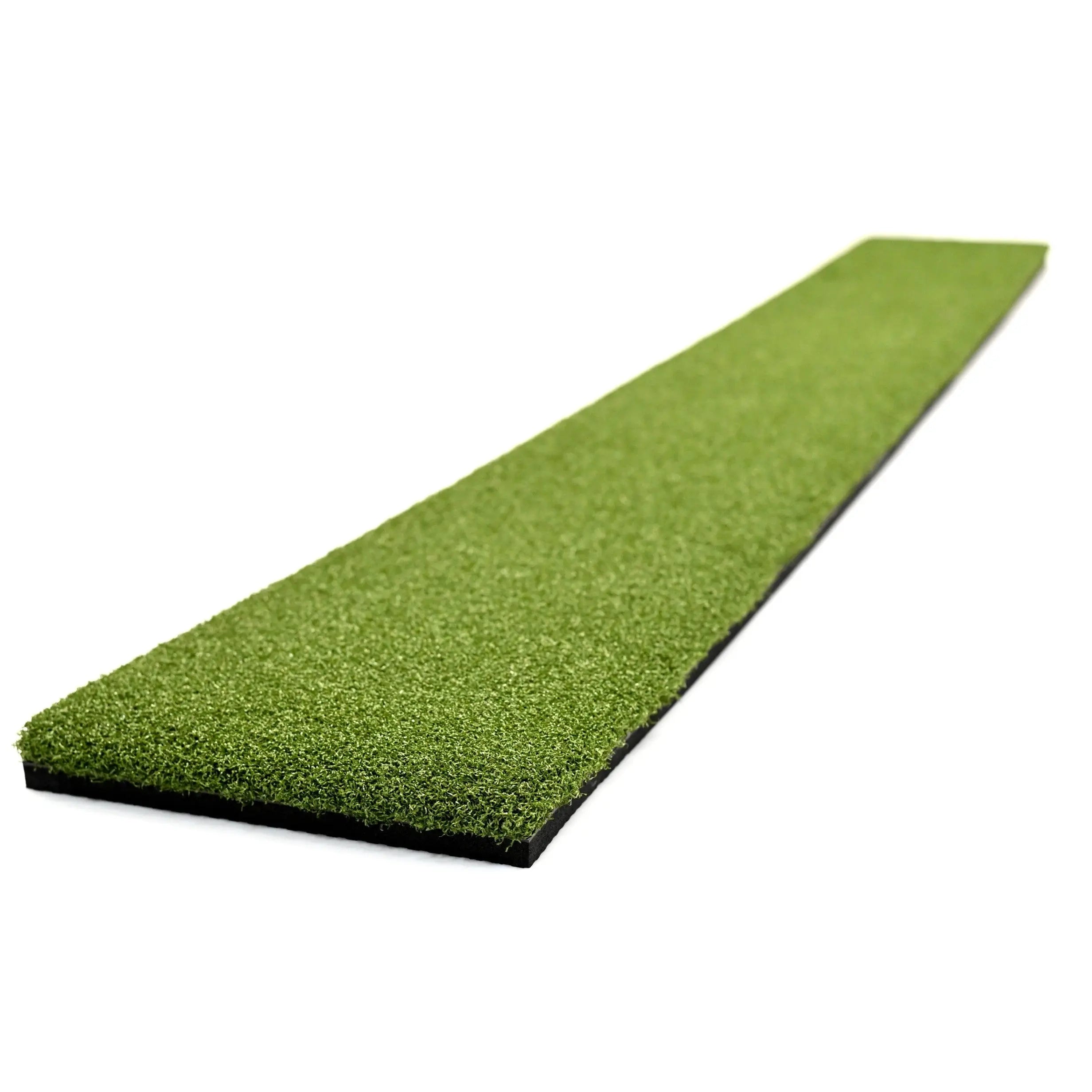 Carl's Golf Mat Extension Strip positioned next to golf mat with launch monitor on elevated surface