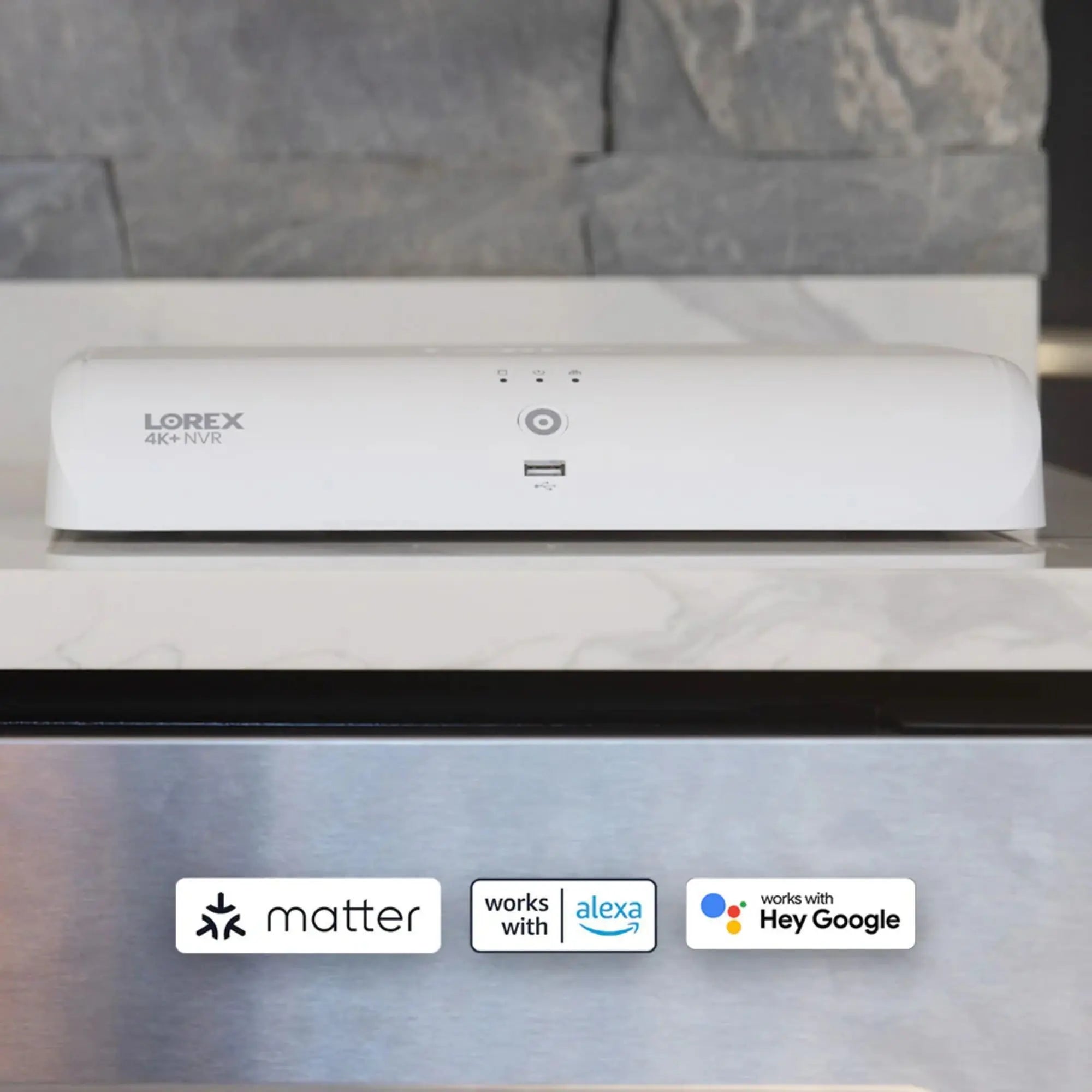 LOREX security camera on a kitchen counter with connectivity logos below.